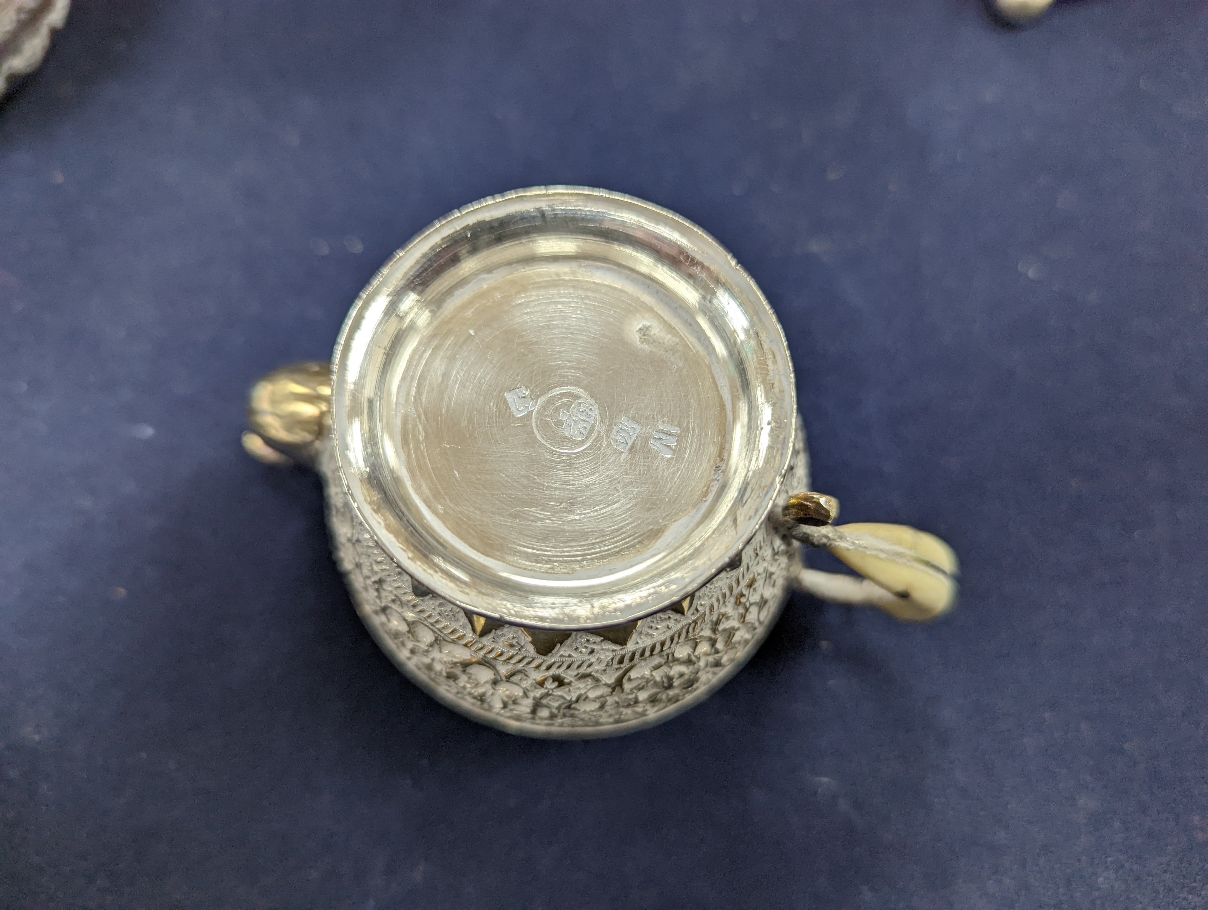 A set of six Persian embossed 84 standard white metal coffee cup holders and matching sugar bowl and cover by Vartan and four other Persian white metal items.